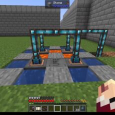 Minecraft screenshot of a compact redstone/tile-based machine with blue glass-encased frames over water channels, set in a walled grassy courtyard; the player's inventory and hand are visible at the bottom right.