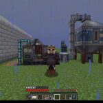 Minecraft scene: player in dark armor standing in rain beside industrial machines and a stone wall on a grassy plain, mini-map in corner.