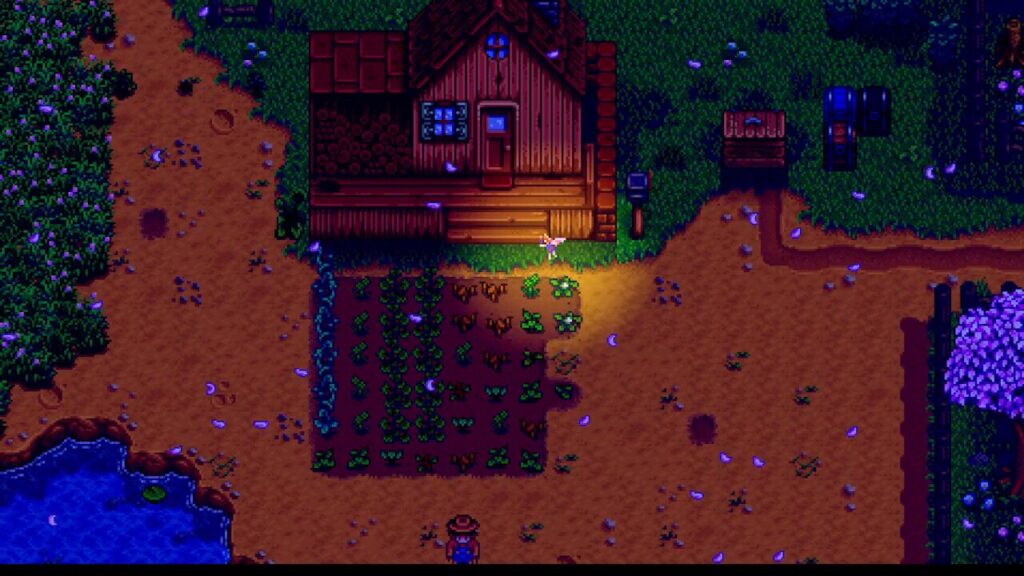Top-down pixel-art farm at night: wooden cabin with a small porch, vegetable garden beds in front, and a lone farmer on the path