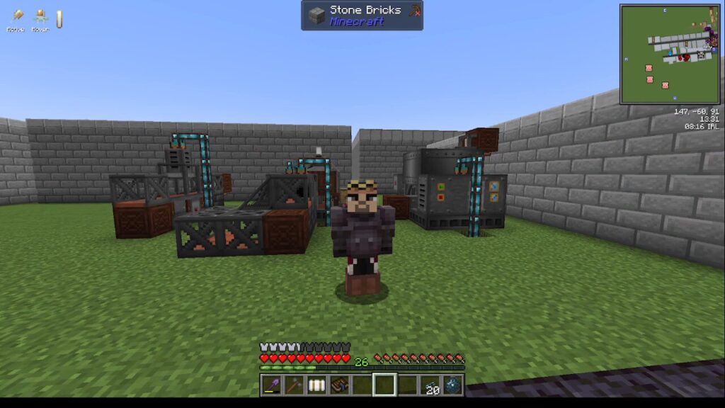 Minecraft scene showing a player standing on grass in a fenced area with industrial machines and pipes against stone brick walls in the background.