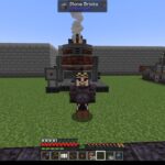 Minecraft character in dark armor stands before a tall industrial furnace with smoke rising, set on a grassy base surrounded by machinery and stone walls.